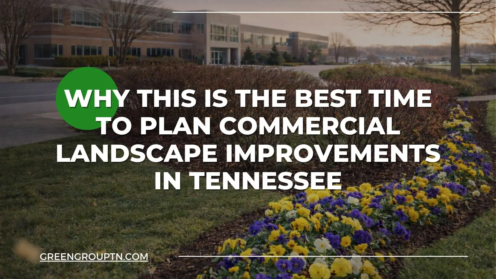 Commercial office property in Tennessee with maintained winter landscaping and seasonal flower beds, illustrating early planning for commercial landscape improvements.